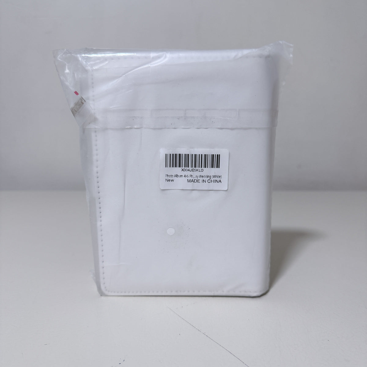 4x6 Photo Album, White Faux Leather with Snap Strap, Holds 68 Photos